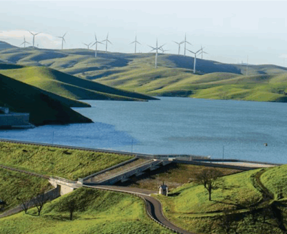 Los Vaqueros Resevoir with rolling hills and wind farm in background